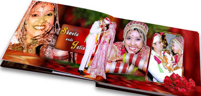 An open Karizma wedding album with a bride and groom across a red spread